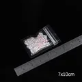 Bunte Makronen-Miniperlen im 7x10cm dicken, transparenten PE-Druckverschlussbeutel - Kleinster Stil
