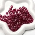 Deep red abacus glass beads for DIY jewelry making displayed on a star ceramic tray - Abacus Style / 25 Pieces/Pack (8x5mm) / Red Agate