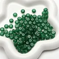 Green translucent glass abacus beads 8x5mm for DIY jewelry making on white tray - Dark Green