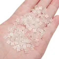 Translucent white resin four-petal flower beads held in hand for DIY jewelry making - 5mm (20 Pieces/Pack) / Transparent Beige