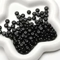 Polished black glass abacus beads 8x5mm in a white ceramic dish for DIY jewelry - Black