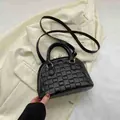 Borsa a mano nera con trama intrecciata, doppi manici e tracolla regolabile chic - Nero