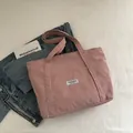 Minimalist pink corduroy tote bag with Fashion Instinct label and shoulder straps - Pink