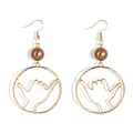 Close-up of golden Shaka hand gesture earrings with brown pearl bead on white background - Brown (HWX1674-9)