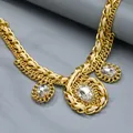 Close-up of double-layer gold chain necklace with large zircon pendants and faux leather cord - Transparent Oval Crystal Style (PLN160)