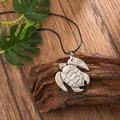 Macro shot of carved natural shell turtle pendant with iridescent luster on black cord - Sea Turtle Style (HWBN221)