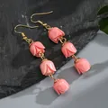 Elegant handmade pink tulip drop earrings with gold hooks on a grey stone background - Bright Pink (HWX2727-7)