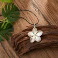 Hawaiian shell plumeria flower pendant on a black cord necklace with iridescent finish - Plumeria Style (HWBN239)