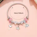 Detail of 18cm silver charm bracelet featuring pink crystals and princess crown pendant - Pink