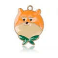 Cute Shiba Inu dog charm in orange enamel with green scarf and gold metal finish - Yellow Dog Style