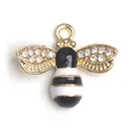 Golden honey bee charm with sparkling rhinestone wings and black enamel stripes - White Bee Pendant