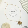 Golden round pendant necklace with natural shell inlay and floral pattern on white background - Hollow Floral Style (HWBN54)