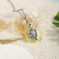Silver sea turtle pendant with yellow sea glass and pearl on white sand beach - Yellow Frosted Stone Turtle Style (HWGN621-5)