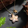 Detail of Hawaiian style necklace with shell flower, golden starfish and blue bead pendant - Flower Starfish Blue Bead Style (HWNX878ST-5)