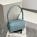 Sparkly light blue glitter cylinder handbag with silver chain strap and top handle - Blue