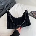 Black plush underarm bag with vertical ribbed texture and leather shoulder strap - Black