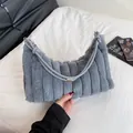 Chic grey faux fur hobo bag with vertical stitching and leather handle for winter - Gray