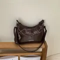 Deep coffee brown half-moon tote bag with glossy leather texture and silver chain - Coffee Large
