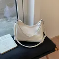 White faux leather crescent bag with silver chain strap and shoulder handle - White Small