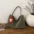 Minimalist olive green suede tote bag with cute red apple pendant for stylish daily commute - Green with Charm