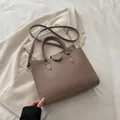 Deep khaki pebbled leather underarm bag with top handles and adjustable strap - Khaki