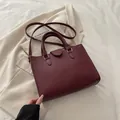 Chic burgundy lychee pattern tote bag with golden hardware and detachable strap - Red
