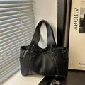 Retro black faux leather tote bag with front zippers and spacious interior for commuting - Black