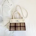 Elegant beige leather and brown plaid texture handbag with silver twist lock and strap - White