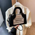 Minimalist beige and black contrast square handbag with BEPRO lettering and top handle - Black