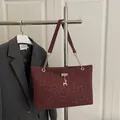 Large burgundy leopard print tote bag with golden deer charm and chain shoulder strap - Red