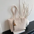 Large cream crocodile pattern tote bag with strawberry charm and woven strap detail - White With Pendant