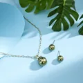 Detail of gold necklace and olive green pearl earrings on a light blue background - Olive Green (HWNX8841-10)