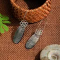 Handcrafted stainless steel earrings with iridescent shell pendants and floral motifs - Silver Hollow Flower Long Oval Shell Style (HWB324)