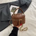 Brown quilted cylinder mini handbag with gold chain strap and dual zipper closure - Khaki