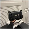 Classic black leather shoulder bag with gold horsebit hardware and adjustable strap - Black