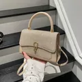 Champagne gold rhinestone handbag with cream leather strap on minimalist steps - Khaki