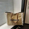 Canvas tote bag with blue Summer embroidery and white tassels for autumn fashion - Khaki