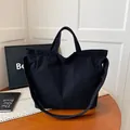 Large capacity black corduroy tote bag with dual handles and long shoulder strap - Black