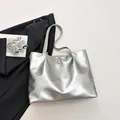 Silver metallic tote bag with chic bow detail and spacious shoulder strap design - Silver