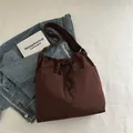 Dark brown nylon tote bag with drawstring closure and adjustable strap on white fabric - Coffee (No Pendant)