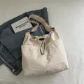 Large beige nylon tote bag with drawstring pocket and adjustable wide strap for daily use - Off-White (Without Pendant)