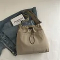 Khaki nylon drawstring tote bag with large front pocket and wide shoulder strap - Khaki (Without Charm)
