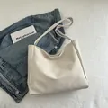 Minimalist creamy white faux leather tote bag with slender straps for daily commute - Rice White (No Pendant)