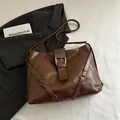 Minimalist large brown leather tote bag with silver buckle and adjustable side straps - Brown