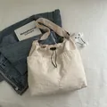 Beige nylon tote bag with drawstring closure and cute cloud charm for casual daily use - Off-White (With Pendant)