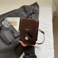 Mini coffee leather crossbody phone bag with gold pendant and fashion print - Coffee