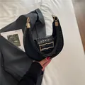 Classic black stone-pattern PU leather underarm bag with gold wave buckle and ring handle - Black