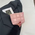 Chic light pink quilted cosmetics bag with grid stitching and soft padded texture - Pink