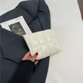 White puffer clutch featuring classic square quilting and lightweight nylon fabric - Off White