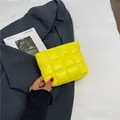 Fluorescent yellow quilted clutch bag with padded lattice design on grey blazer - Yellow